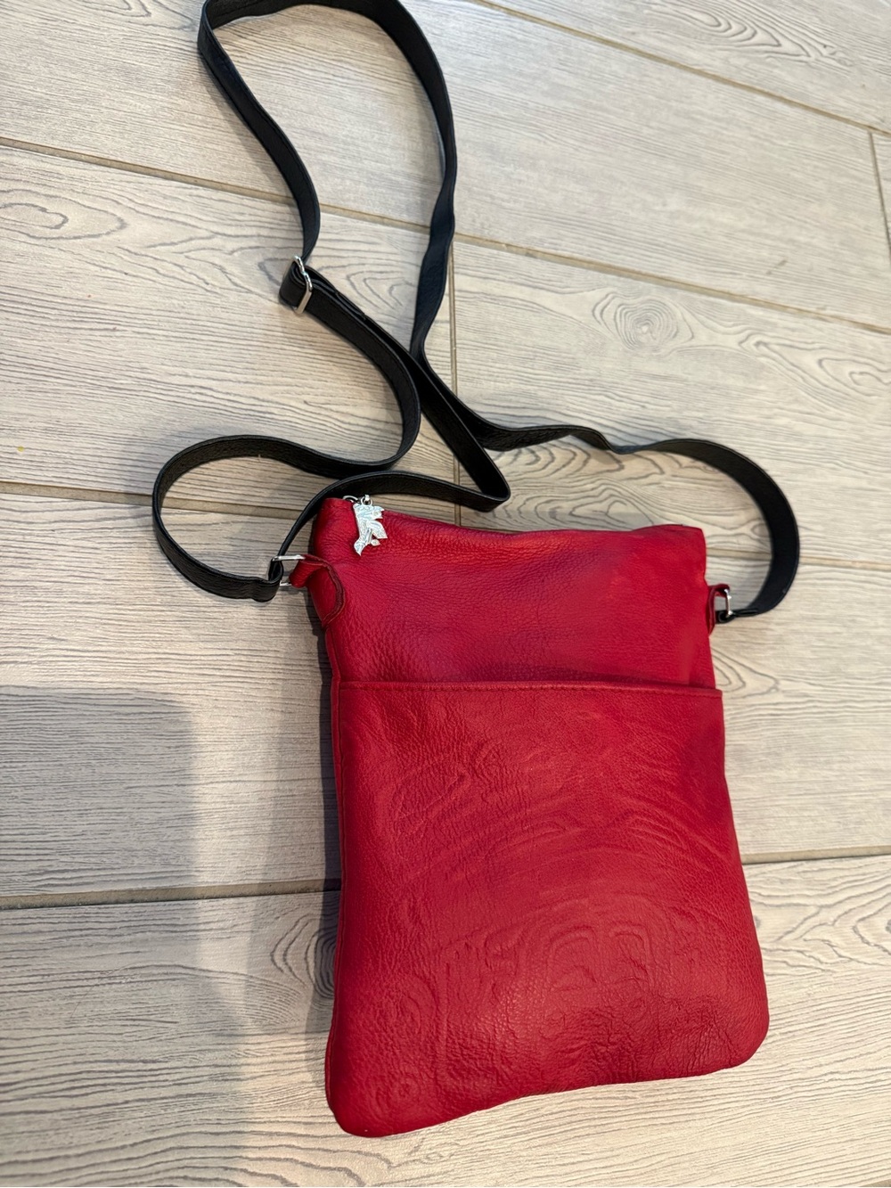 Spirit of the Wild pebbled embossed Red Leather Crossbody Bag with Black Strap